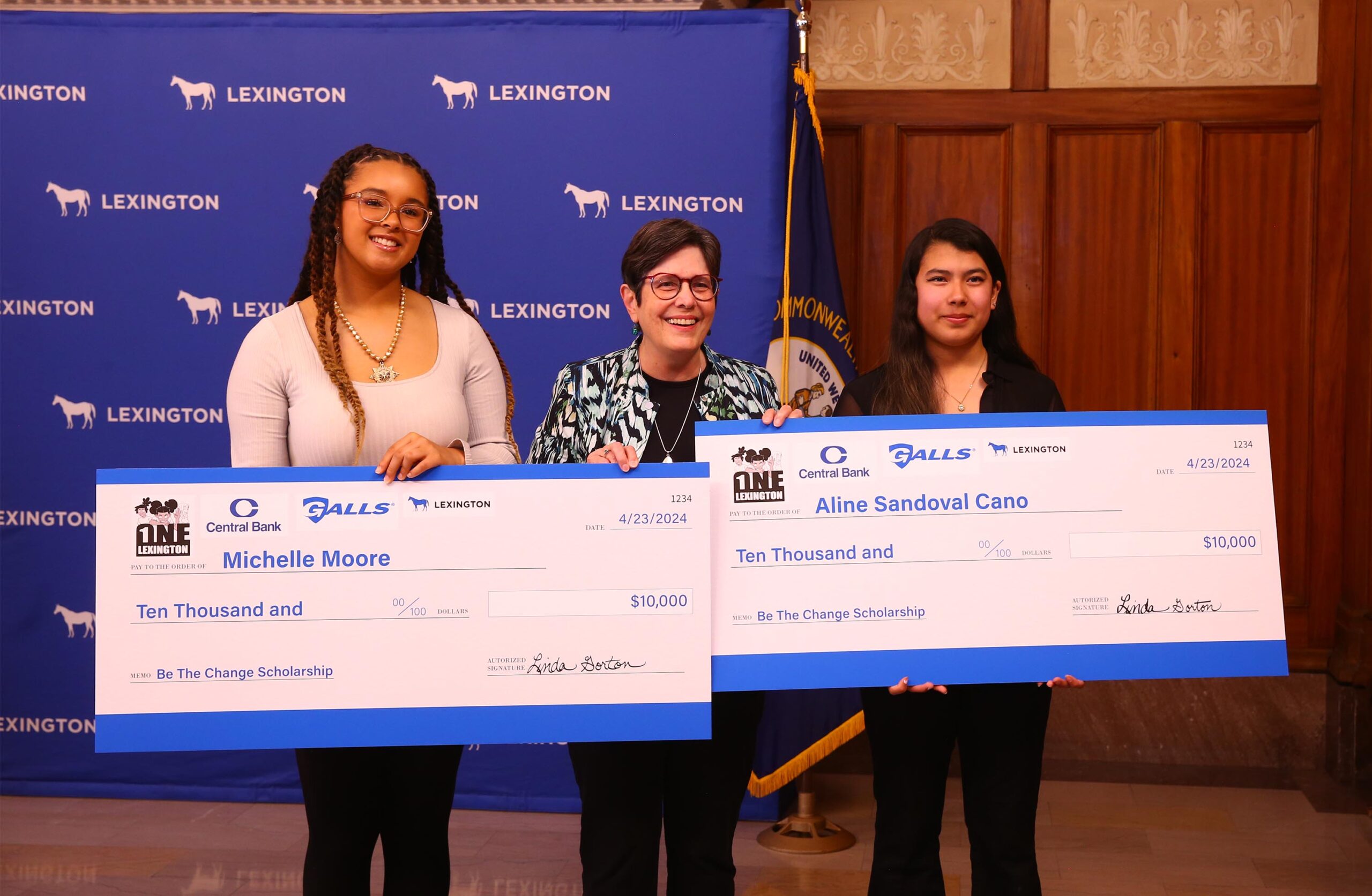 Lexington, Kentucky Mayor Linda Gorton announced the winners in the “Be The Change” Scholarship Competition. (L-R): Winner Michelle Moore, Mayor Gorton, and winner Aline Sandoval Cano.