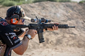 Man shooting a competitive rifle.